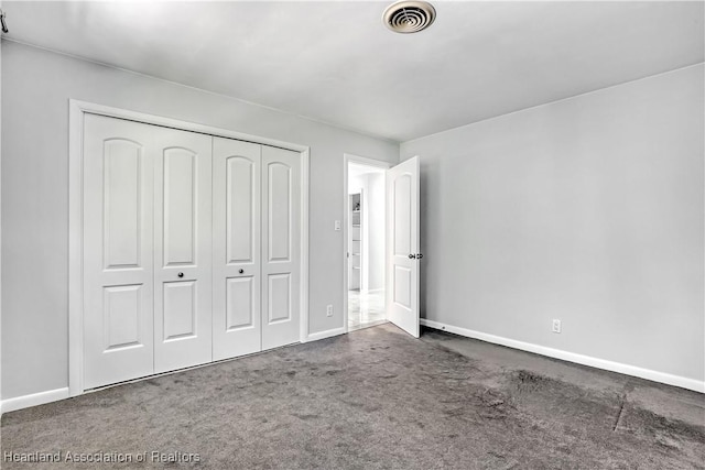 115 Elwa Pl, West Palm Beach, FL 33405 - unfurnished bedroom with carpet and a closet