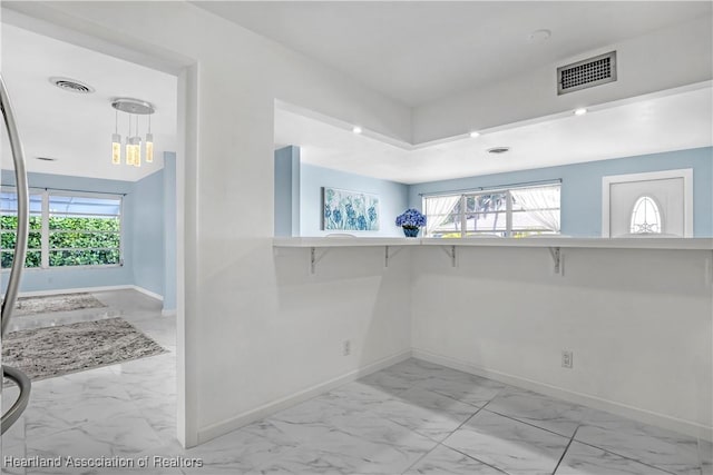 115 Elwa Pl, West Palm Beach, FL 33405 - spare room featuring light marble finish flooring and baseboards