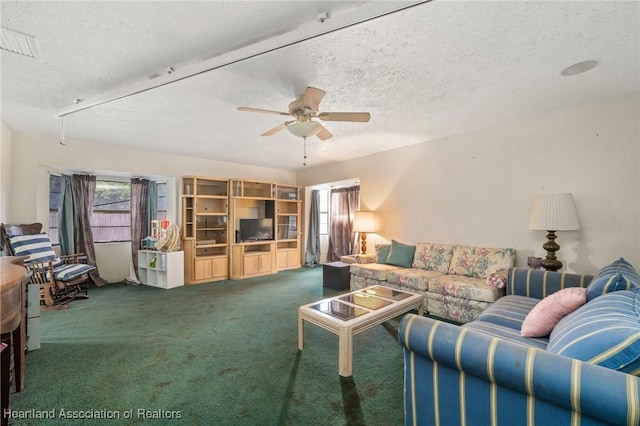 4910 Perch Ave, Sebring, FL 33870 - carpeted living area featuring plenty of natural light, a textured ceiling, and a ceiling fan