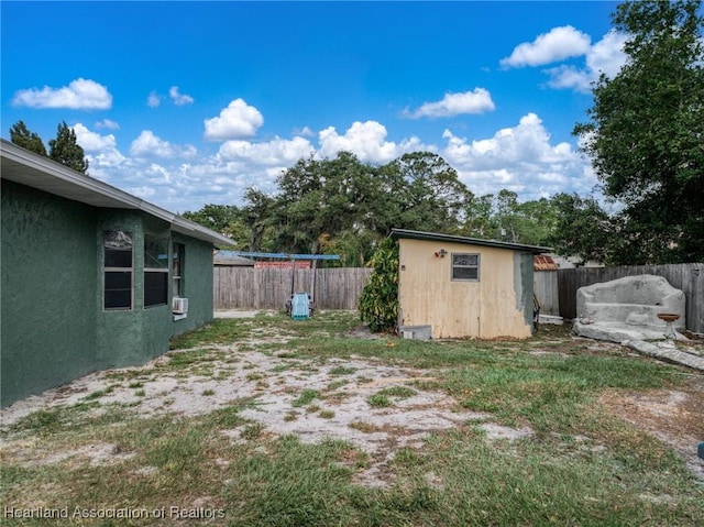 4910 Perch Ave, Sebring, FL 33870 - view of yard featuring a storage shed, a fenced backyard, and an outdoor structure