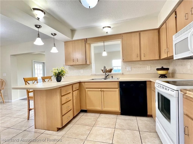 kitchen with sink, a kitchen breakfast bar, kitchen peninsula, pendant lighting, and white appliances