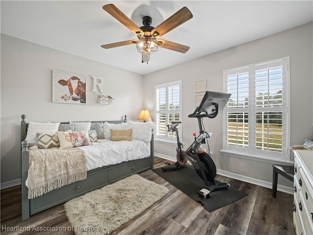 bedroom with ceiling fan and dark wood-type flooring