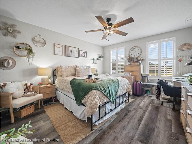 bedroom featuring ceiling fan and dark hardwood / wood-style flooring