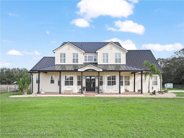 view of front of home featuring covered porch and a front yard