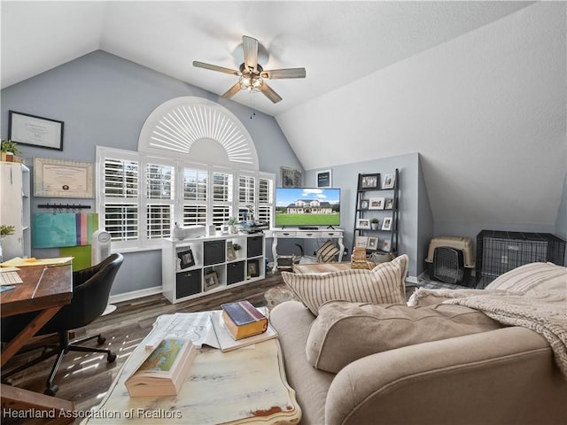 living room with vaulted ceiling, ceiling fan, and wood-type flooring