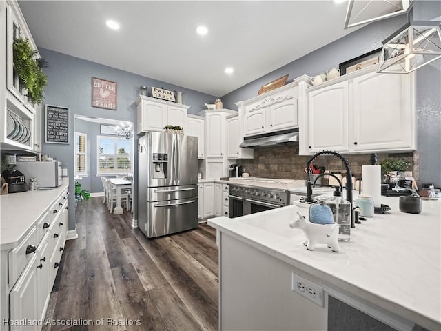 kitchen featuring wall oven, white cabinets, and stainless steel fridge with ice dispenser