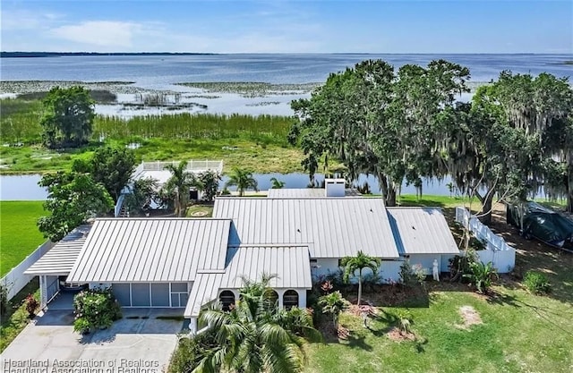 birds eye view of property with a water view