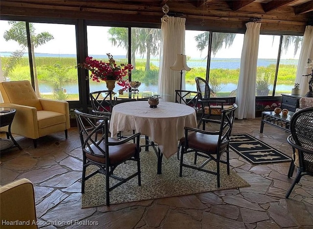 sunroom with a water view