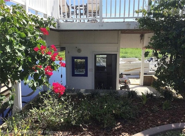 doorway to property featuring a balcony