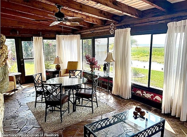 sunroom featuring beam ceiling, ceiling fan, and wood ceiling