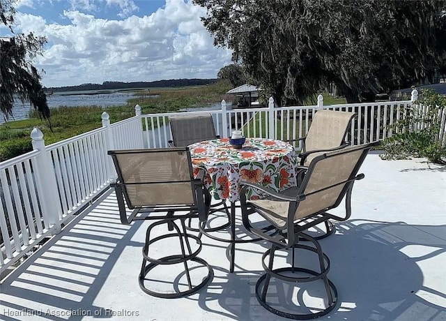 wooden terrace with a water view