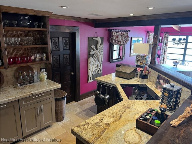 bar featuring an inviting chandelier, light stone counters, black electric cooktop, and ornamental molding