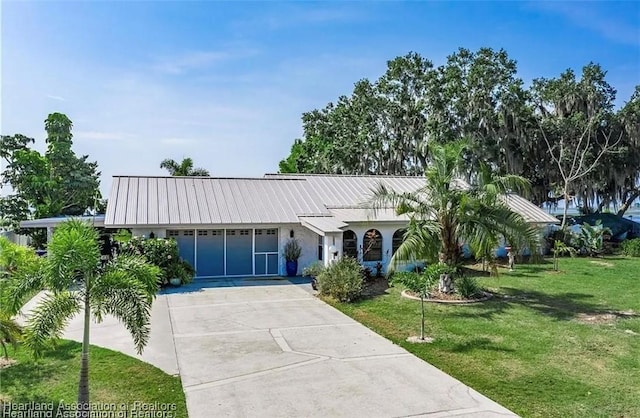 single story home with a front lawn and a garage