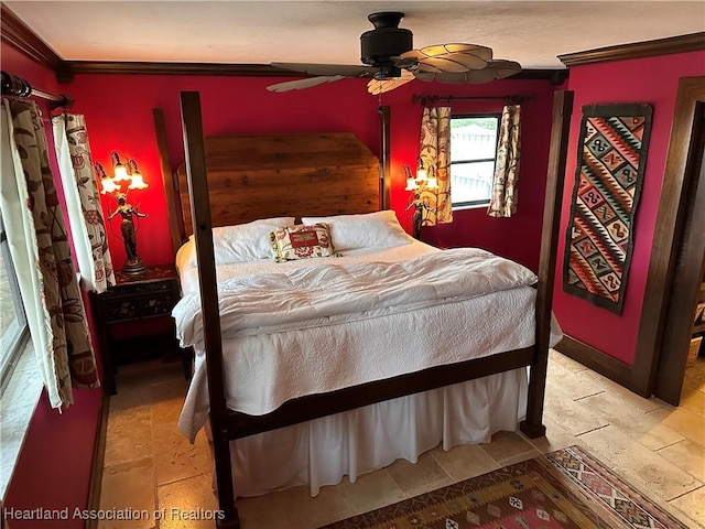 bedroom featuring ceiling fan and ornamental molding