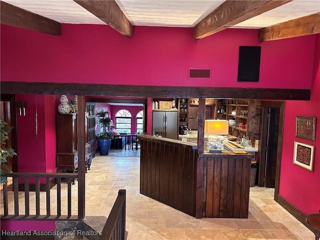 bar with beam ceiling and stainless steel fridge