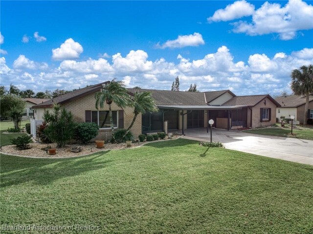 170 Parkview Cir, Lake Placid, FL 33852 - single story home featuring driveway, a carport, a front yard, and brick siding