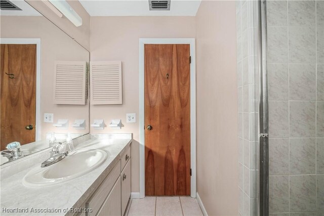 170 Parkview Cir, Lake Placid, FL 33852 - bathroom with vanity, tile patterned flooring, a stall shower, and baseboards