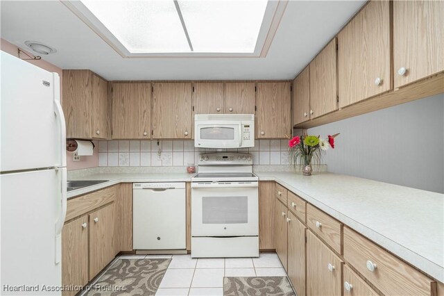 170 Parkview Cir, Lake Placid, FL 33852 - kitchen with white appliances, light countertops, and decorative backsplash