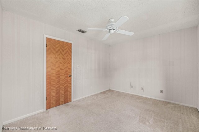 170 Parkview Cir, Lake Placid, FL 33852 - unfurnished room featuring a ceiling fan, carpet, and a textured ceiling