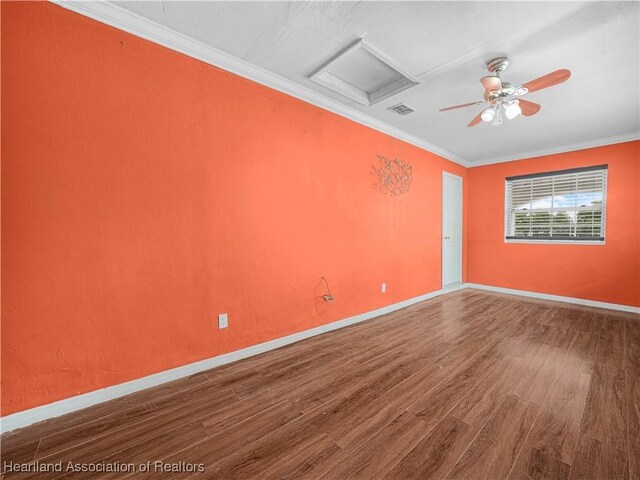 1621 Warfield Pl, Sebring, FL 33870 - unfurnished room with wood finished floors, crown molding, attic access, and a ceiling fan