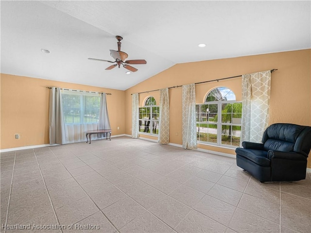 1621 Warfield Pl, Sebring, FL 33870 - unfurnished living room with vaulted ceiling, ceiling fan, healthy amount of natural light, and tile patterned flooring