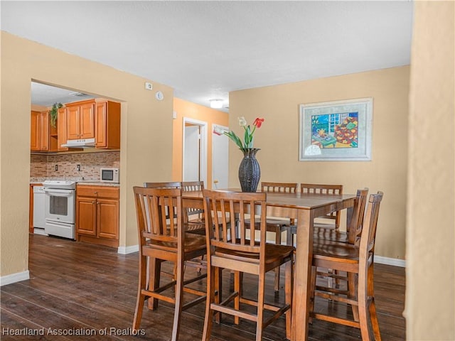 1621 Warfield Pl, Sebring, FL 33870 - dining room with dark wood-style flooring and baseboards
