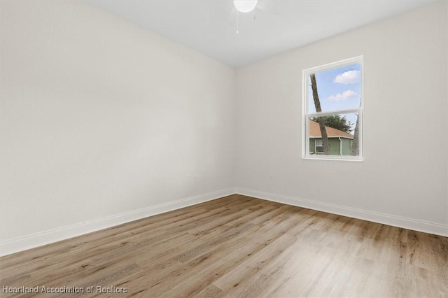 4954 San Ignacio Dr, Sebring, FL 33872 - spare room with wood finished floors and ceiling fan