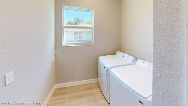 3900 Monza Dr, Sebring, FL 33872 - laundry room featuring baseboards, independent washer and dryer, laundry area, and light wood-type flooring