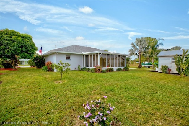 view of yard with a sunroom