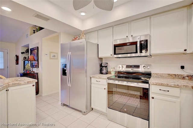 kitchen featuring appliances with stainless steel finishes, white cabinetry, and ceiling fan