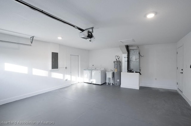 garage featuring washing machine and dryer, electric water heater, electric panel, heating unit, and a garage door opener