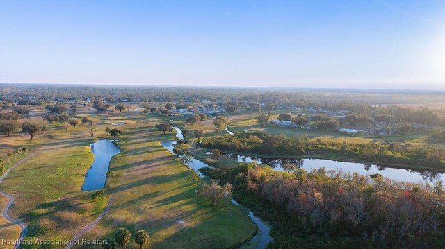 birds eye view of property with a rural view and a water view