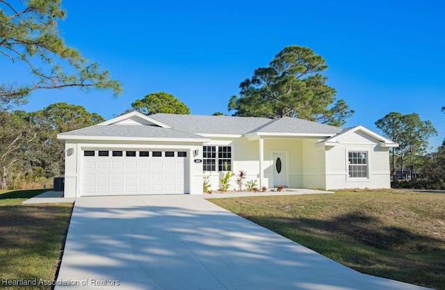 single story home with a front yard and a garage