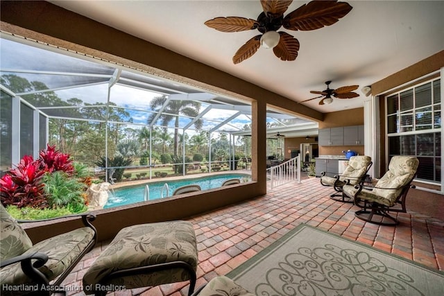 sunroom with pool water feature and a patio area