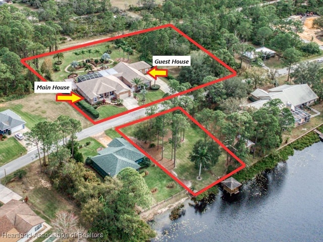 birds eye view of property featuring a water view