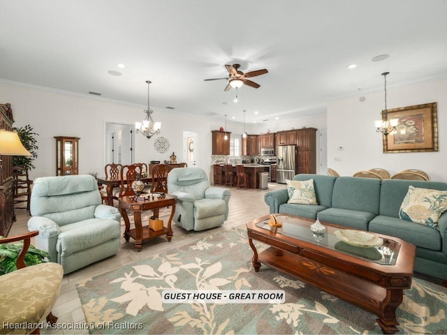 living room with ornamental molding and ceiling fan with notable chandelier