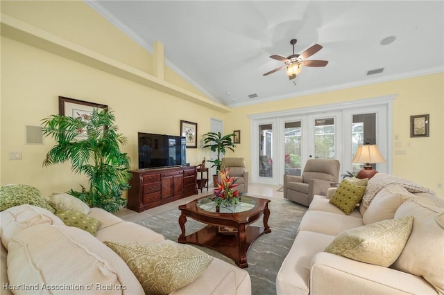 living room featuring french doors, lofted ceiling, crown molding, and ceiling fan