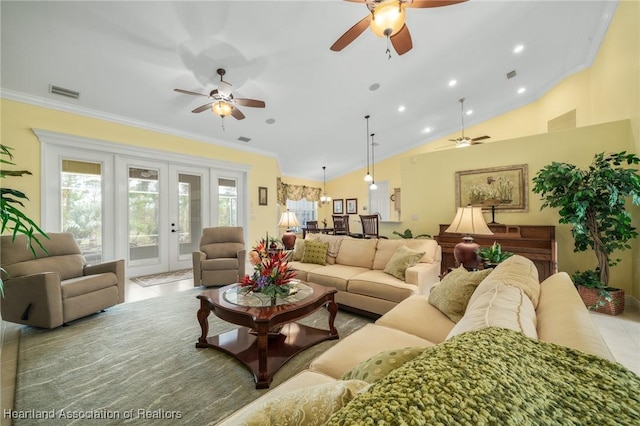 living room with vaulted ceiling, ceiling fan, and ornamental molding