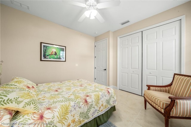 tiled bedroom featuring a closet and ceiling fan