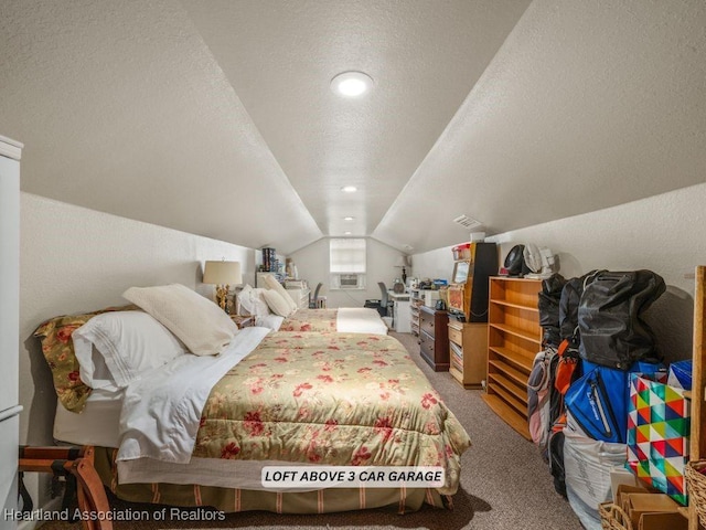 carpeted bedroom with lofted ceiling and a textured ceiling