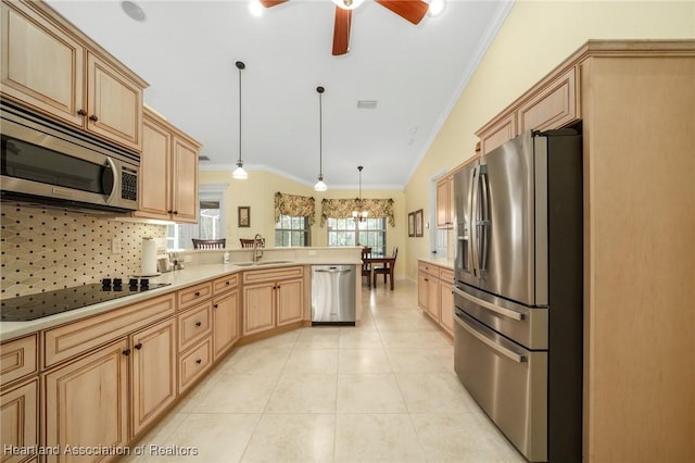 kitchen with stainless steel appliances, decorative light fixtures, light tile patterned flooring, ornamental molding, and sink