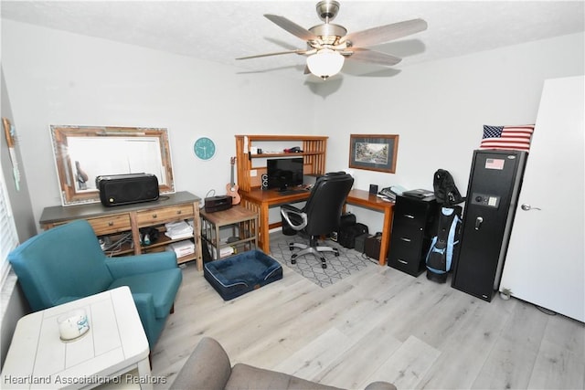 office area with a ceiling fan and wood finished floors