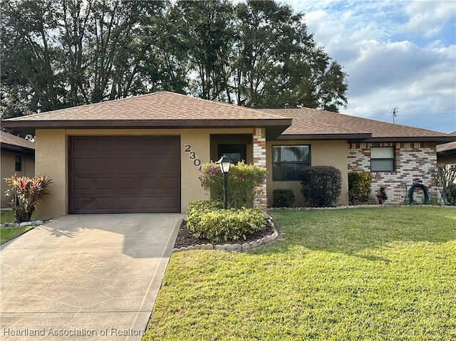 ranch-style home with a front lawn and a garage