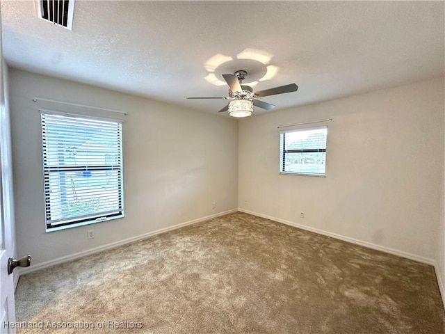 carpeted empty room with ceiling fan