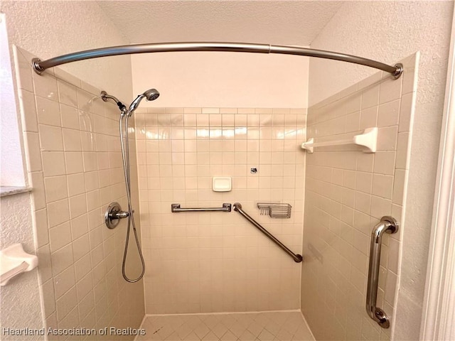 bathroom with tiled shower