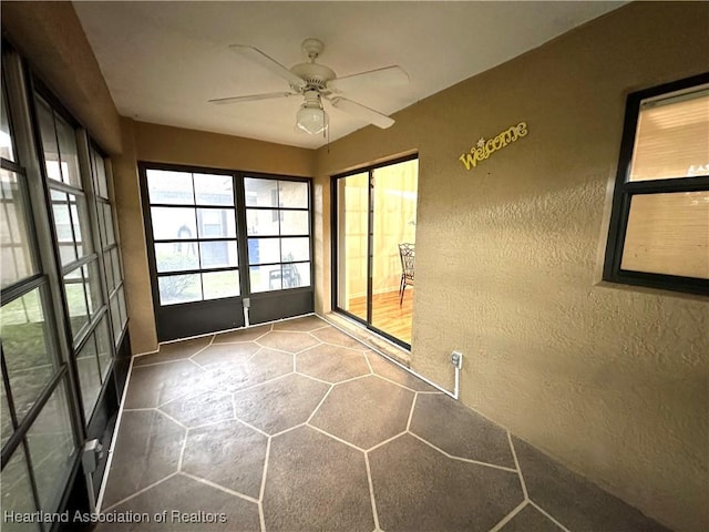 unfurnished room featuring ceiling fan