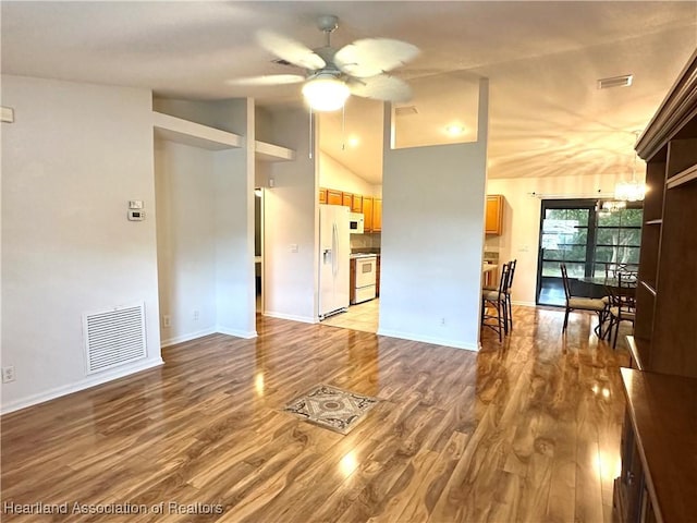 living room featuring light hardwood / wood-style flooring, ceiling fan, and lofted ceiling