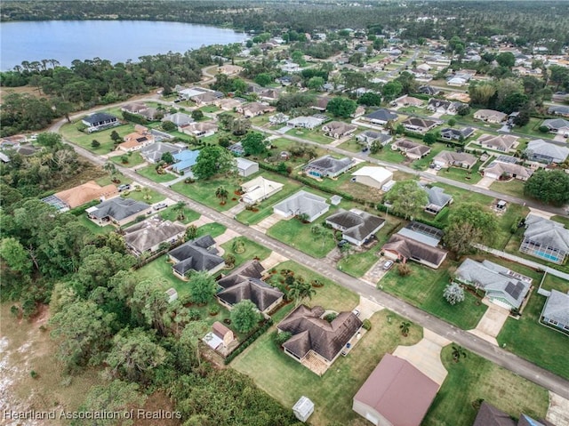 aerial view with a residential view and a water view