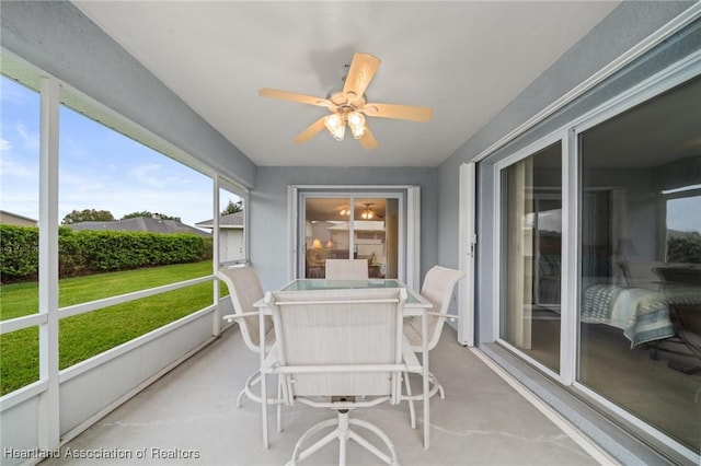 sunroom / solarium with ceiling fan