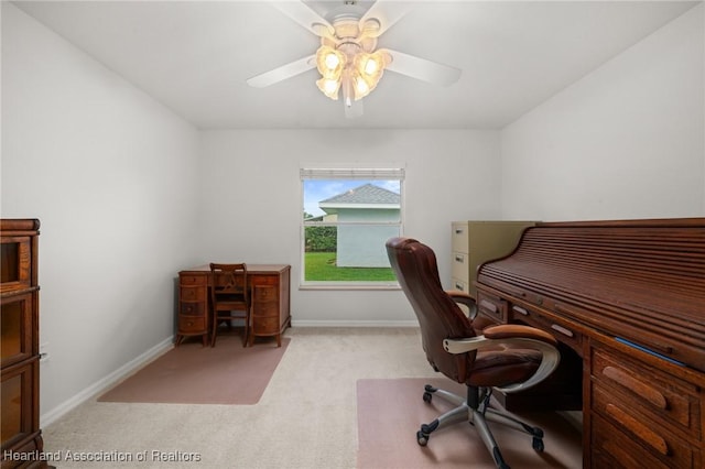 office area featuring baseboards, a ceiling fan, and carpet floors